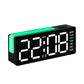 Digital alarm clock with RGB L-shaped night light, white time digits and weekday panel.