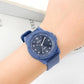 Blue quartz analog wrist watch with silicone strap, worn on wrist