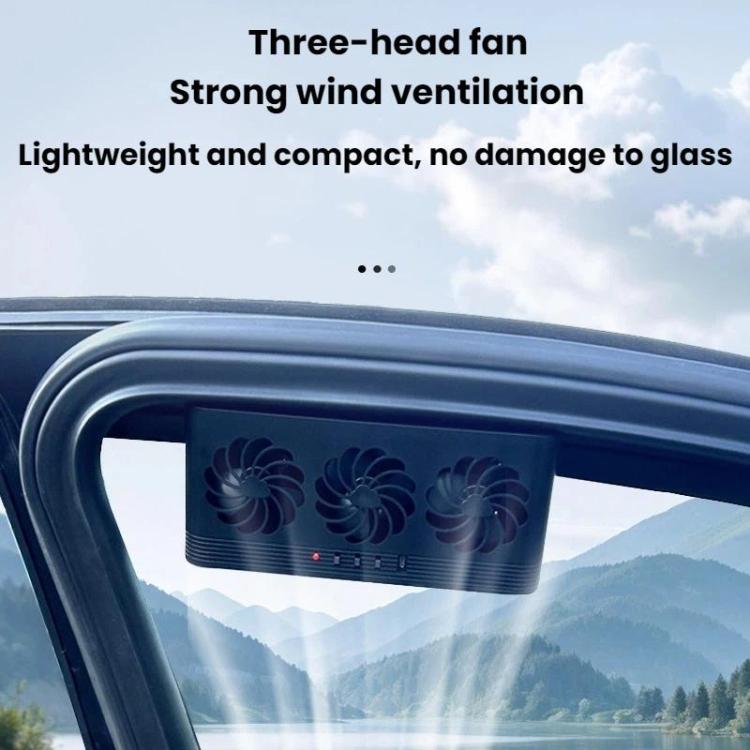 Black three-head solar ventilation fan mounted on a car roof window
