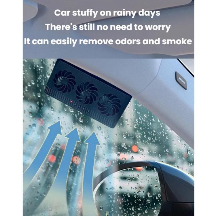 Black solar ventilation fan tilted inside the car windshield area
