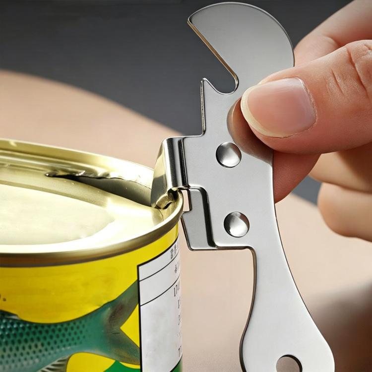 Compact stainless steel can opener blade gripping a can rim