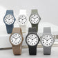Assorted color analog wristwatches with round dials and rubber straps