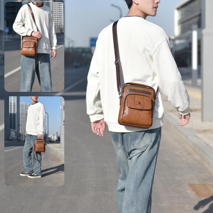 Men's brown crossbody shoulder bag with front zip pocket and logo flap, worn with strap