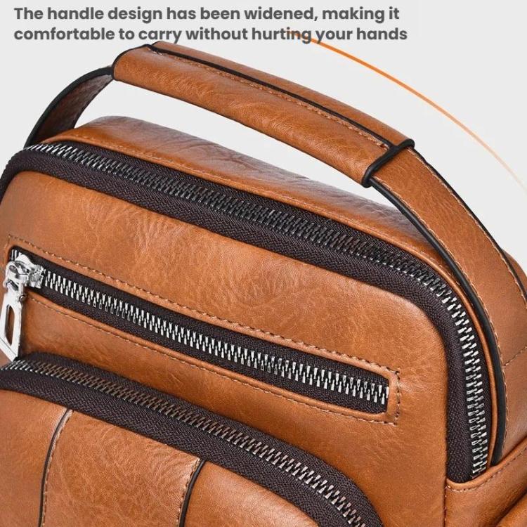 Brown shoulder bag close-up of wide top handle and black zipper trim