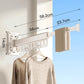 Wall-mounted folding clothes drying rack with white frame and hanging pegs