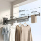 Extended wall-mounted clothes drying rack with dark grey rods and hanging clips