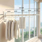 4-fold wall-mounted drying rack with retractable white rod and hanging hooks