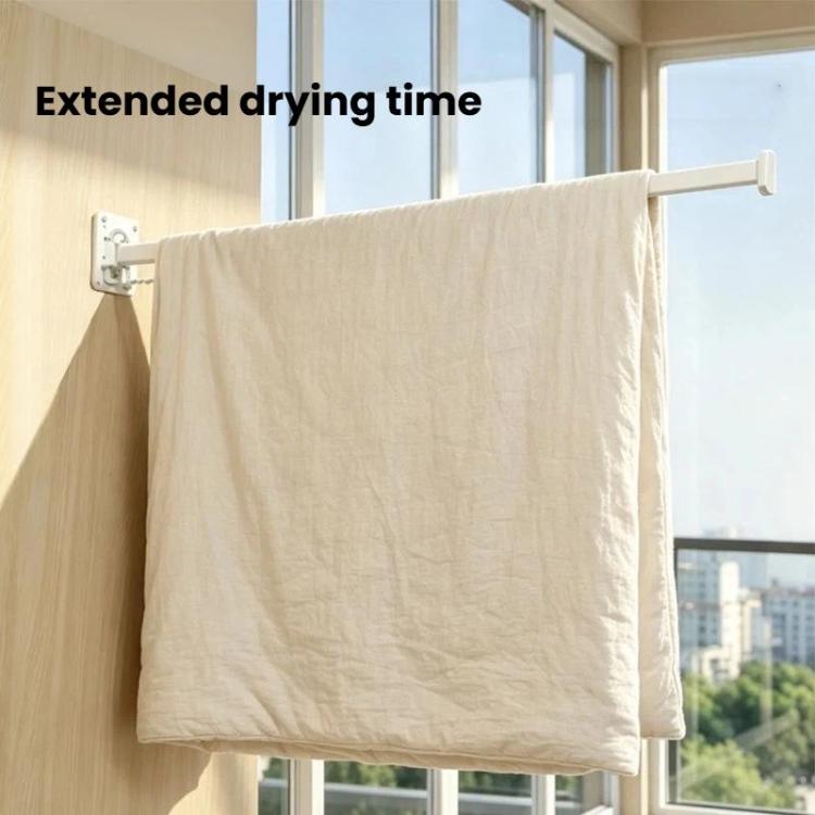 Wall-mounted folding drying rack with retractable bar holding a folded towel
