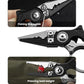 Mini fishing line cutter pliers close-up, open ring and cutting edge, black and silver.