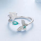 Silver double-layer butterfly ring with green teardrop stone and clear accents