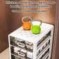 White drawer-style storage box with clear drawers and rounded handles, on tabletop