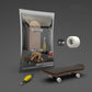 Finger skateboard toy with white wheels and wooden deck, shown in retail box