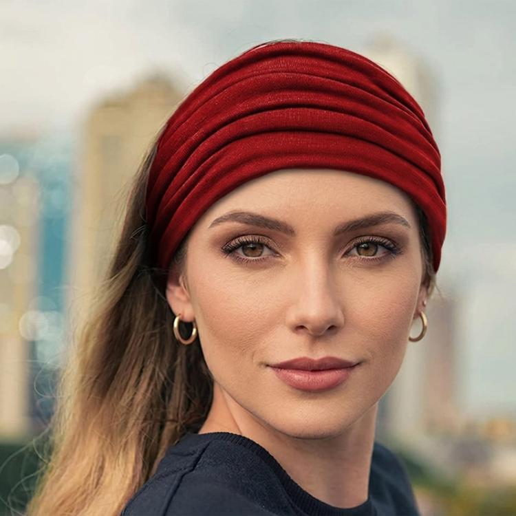 Extra wide elastic cross headband in red, wrapped style over the head