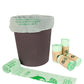 Compostable PLA garbage bag liner on a bin with rolled bags, light green and brown