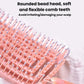 Close-up of pink comb teeth on rounded hollow hair massage brush head