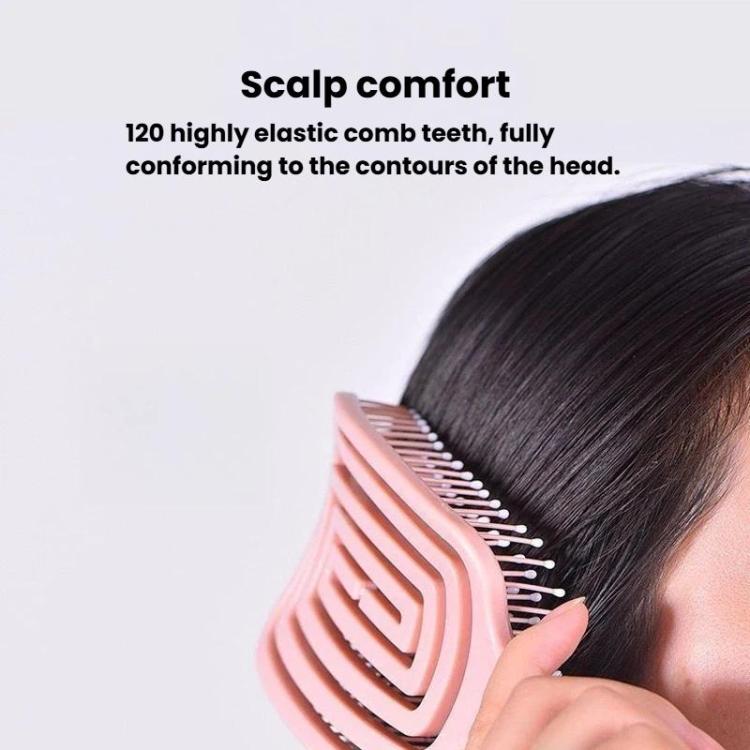 Pink hair massage comb brushing dark hair with flexible teeth
