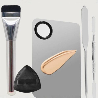 Makeup foundation brush with spatula mixing tools, ring palette, and powder puff