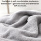 Gray fleece baby swaddle towel fabric close-up with plush texture