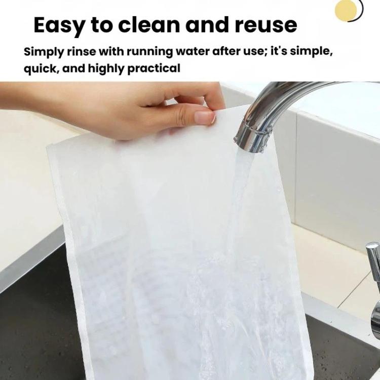 White filter bag rinsed under a kitchen faucet, ready for reuse.