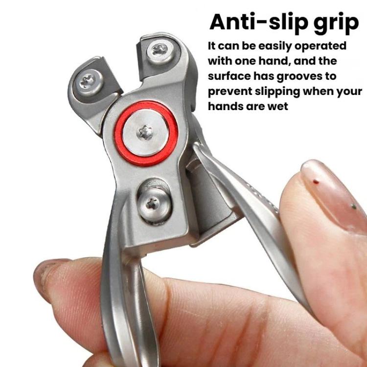 Fishing line cutter pliers held in hand, silver tool with red ring and textured grip