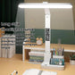 White arc-style LED desk lamp with time display and pen holder base