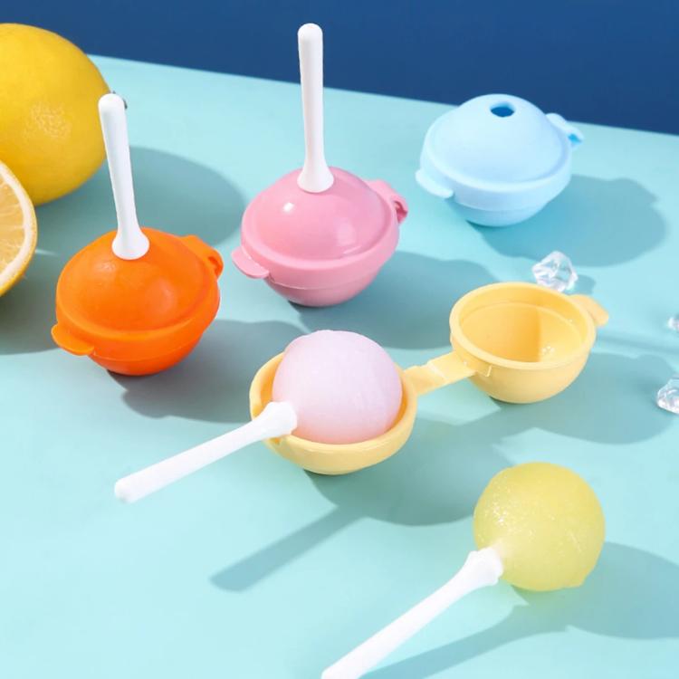 Assorted lollipop ice pop molds in orange, pink, blue, and yellow with white sticks