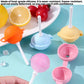 Silicone ice pop molds in pink, blue, orange, and yellow with white sticks