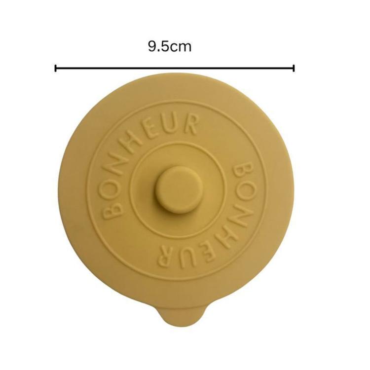 Tan round silicone lid, 9.5 cm width, with raised center knob and BONHEUR embossing
