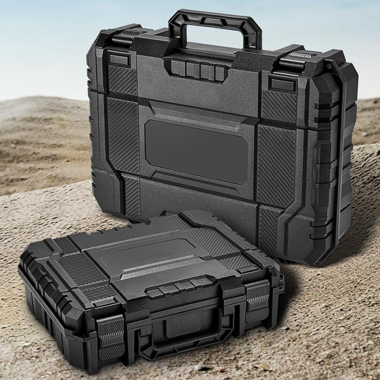 Portable dark plastic toolbox with lid closed, shown on outdoor ground surface