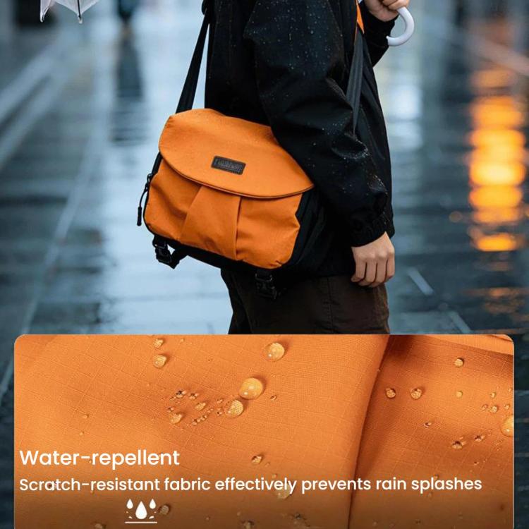 Orange camera shoulder bag with textured water-splash fabric detail