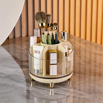 Champagne 360-degree rotating makeup organizer with clear body and gold brush holders
