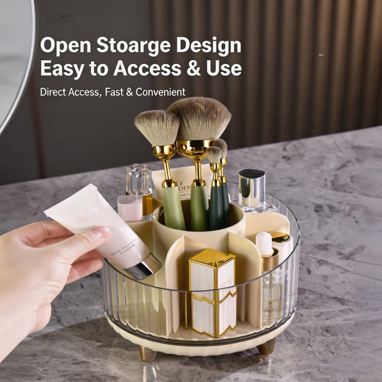 Gold-toned rotating makeup organizer with clear body and open storage for cosmetics