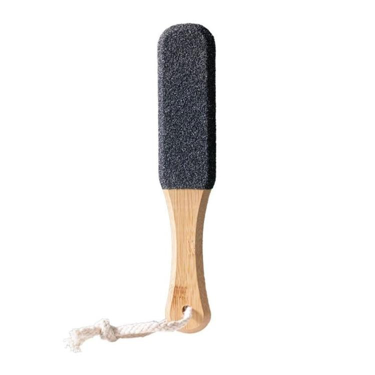 Foot callus remover tool with dark rectangular abrasive pad and bamboo handle