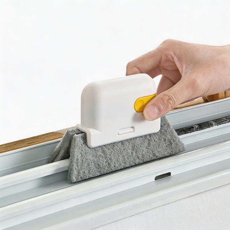 Hand-held window groove cleaning brush with gray scrub pad and yellow scraper edge