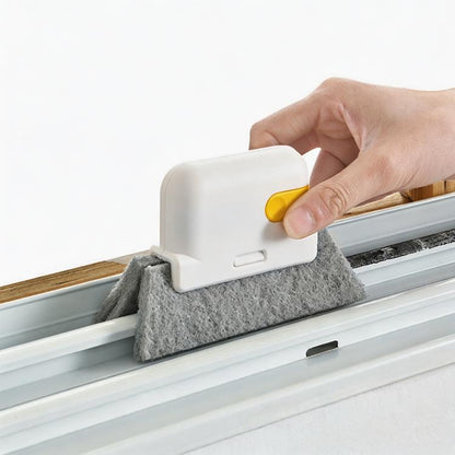 Hand-held window groove cleaning brush with gray scrub pad and yellow scraper edge