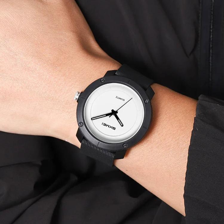 SKMEI unisex quartz watch with black case, white dial, and black leather strap