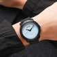 SKMEI unisex watch with black case, pale blue dial, and black textured strap