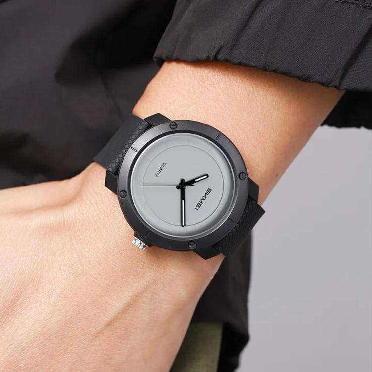 SKMEI unisex watch with black case, gray dial, and black strap on wrist