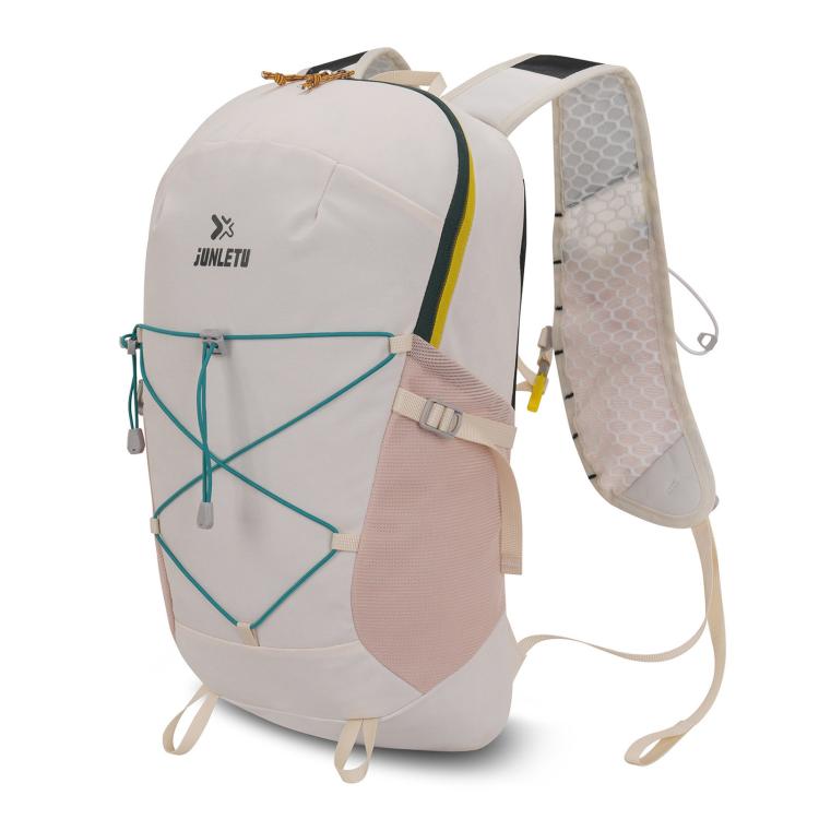 White waterproof trail backpack with green trim and mesh ventilated shoulder panel