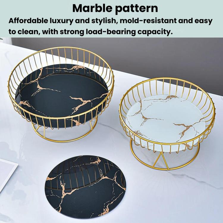 Pair of round wrought iron fruit trays with gold rims and black-and-white marble pattern inserts.