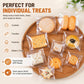 Clear self-sealing cookie bags with treats inside on a wooden serving tray