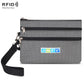 Light gray two-zip card pouch with wrist strap and RFID-protecting lining