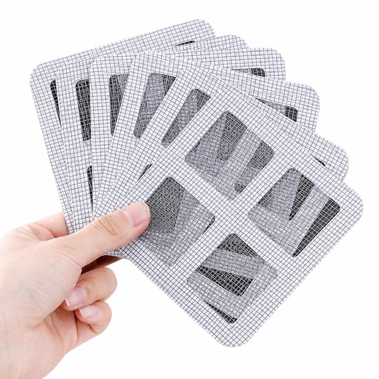 Hand holding disposable white square mesh drain hair catcher stickers