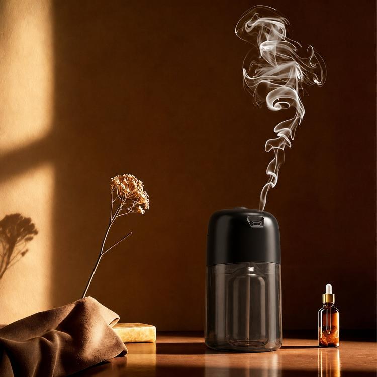 Black smart aroma diffuser machine releasing mist