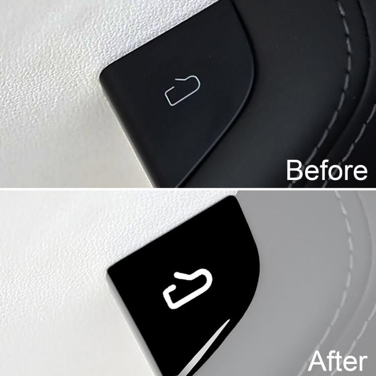 Black door switch sticker with white icon on car door trim