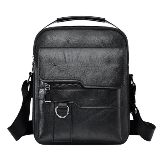 Black leather-look crossbody/handheld bag with top handle and front buckle strap.
