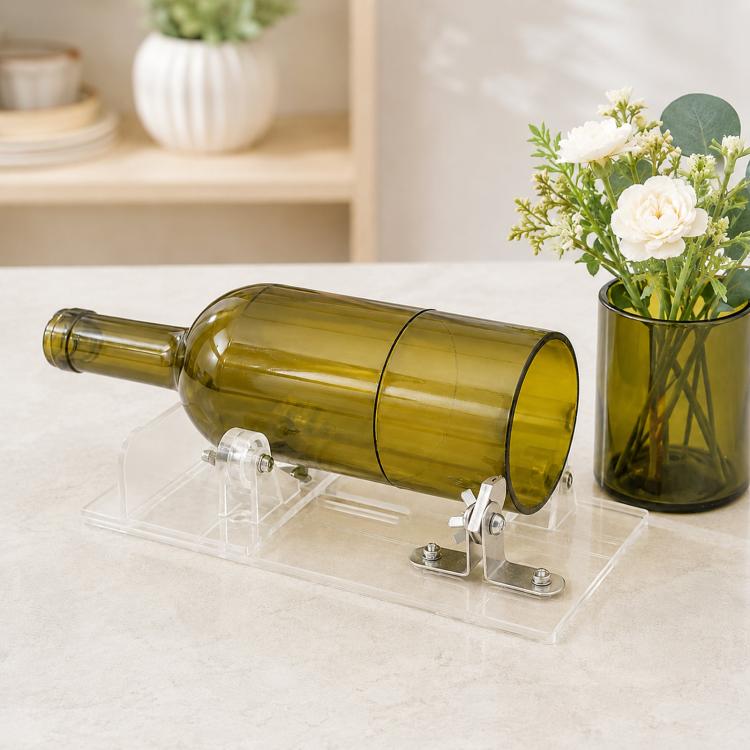 Glass bottle cutter tool with transparent base, metal cutting holder and amber bottle clamp