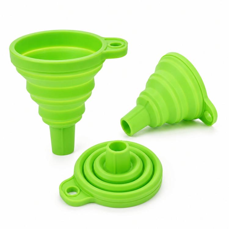 Set of green collapsible silicone funnels with spout and folded storage cap