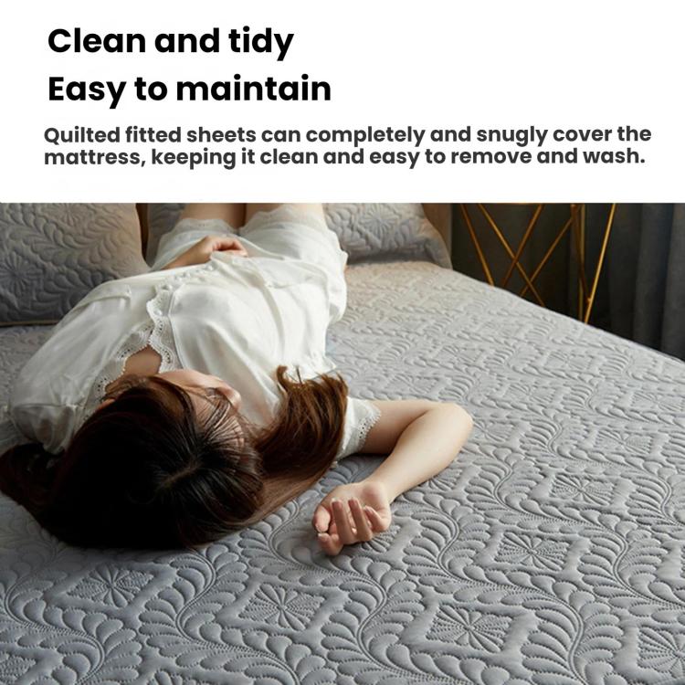 Quilted waterproof fitted crib sheet on a mattress with textured surface and secure fit.