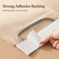Adhesive backing strip attaching to beige mesh bag holder with elastic net panel.